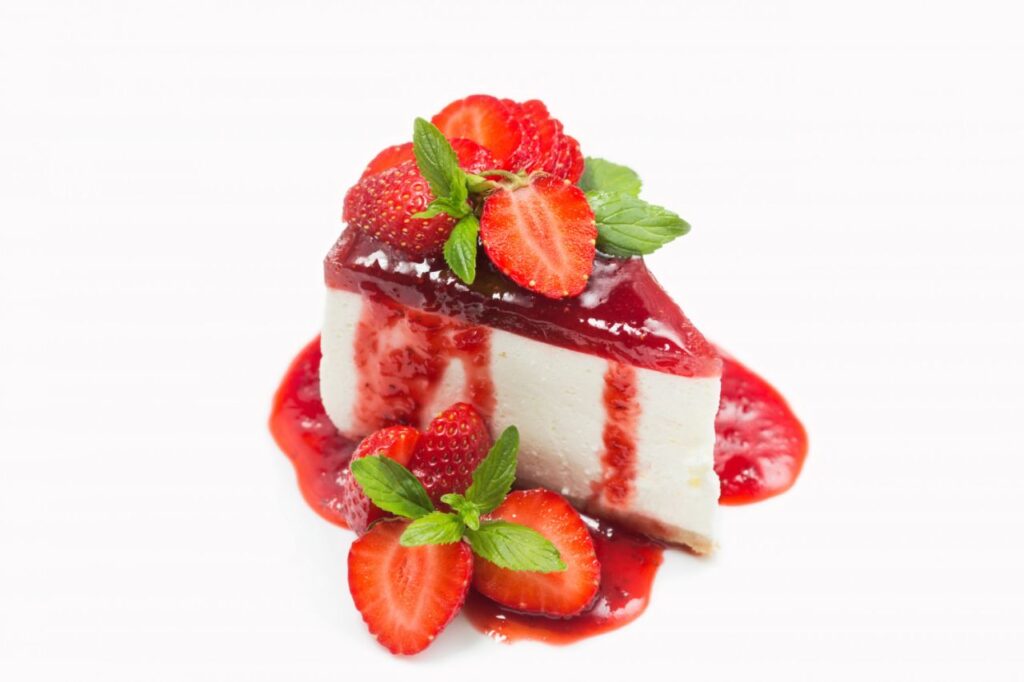 cheesecake with strawberry jelly jam berries mint leaves isolated