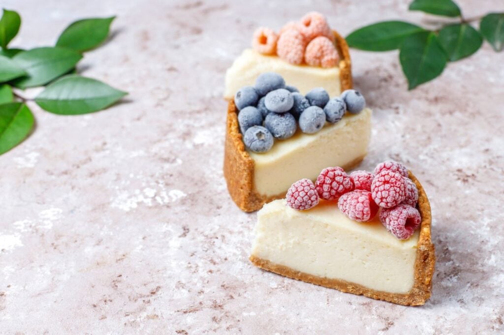 homemade newyork cheesecake with frozen berries mint healthy organic dessert top view